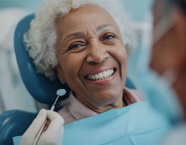 Happy senior patient getting a dental checkup