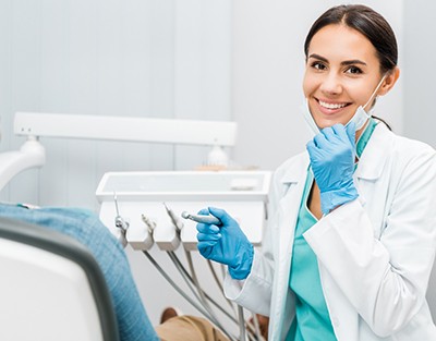 Dentist smiling at patient's dental exam