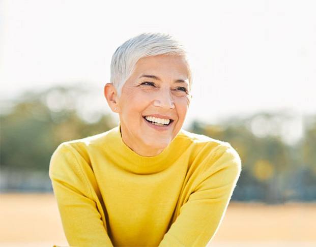 Smiling mature woman enjoying time outdoors