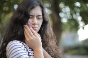 Woman experiencing dental pain